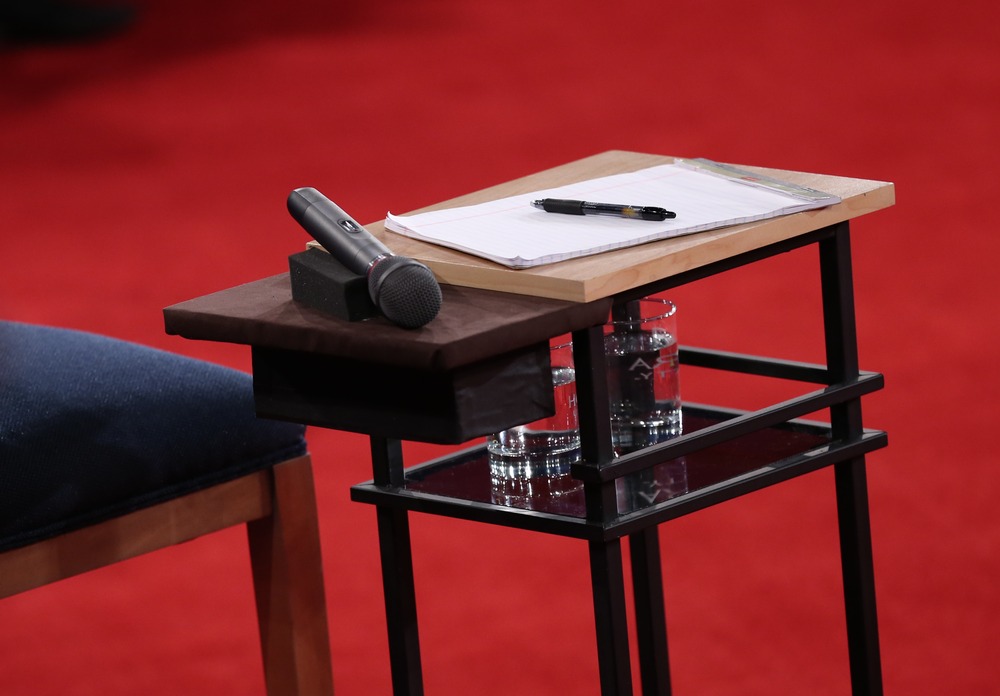 A microphone lies on a table next to a candidate's chair before Republican presidential candidate Mitt Romney and U.S. President Barack Obama answer questions during a town hall style debate at Hofstra University October 16, 2012 in Hempstead, New York.