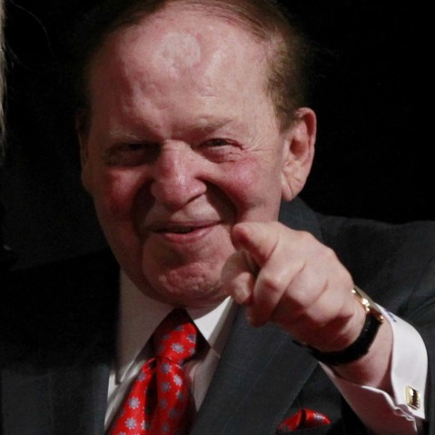 Chairman and CEO of the Las Vegas Sands casino Sheldon Adelson, a donor to Republican presidential nominee Mitt Romney, points to photographers at the end of the first presidential debate between Romney and President Barack Obama in Denver Oct. 3. ...