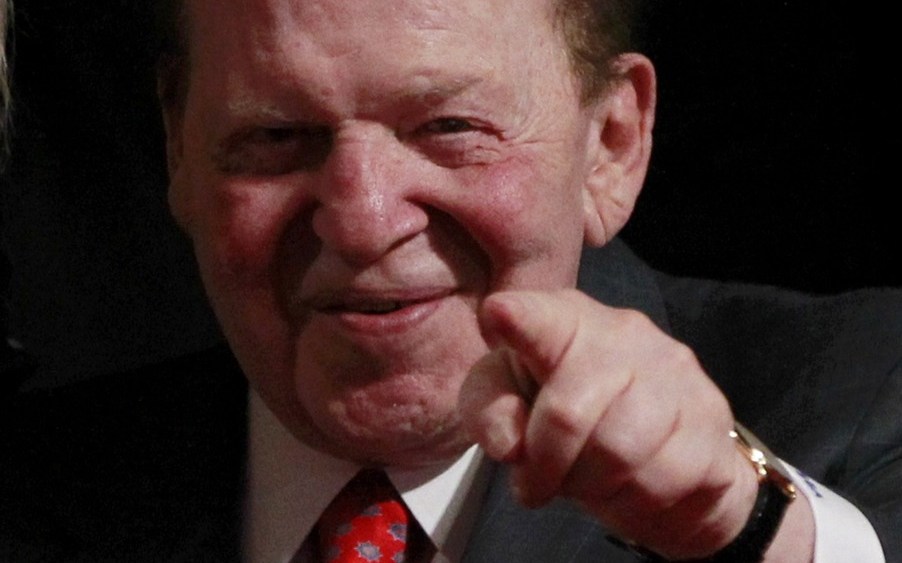 Chairman and CEO of the Las Vegas Sands casino Sheldon Adelson, a donor to Republican presidential nominee Mitt Romney, points to photographers at the end of the first presidential debate between Romney and President Barack Obama in Denver Oct. 3. ...