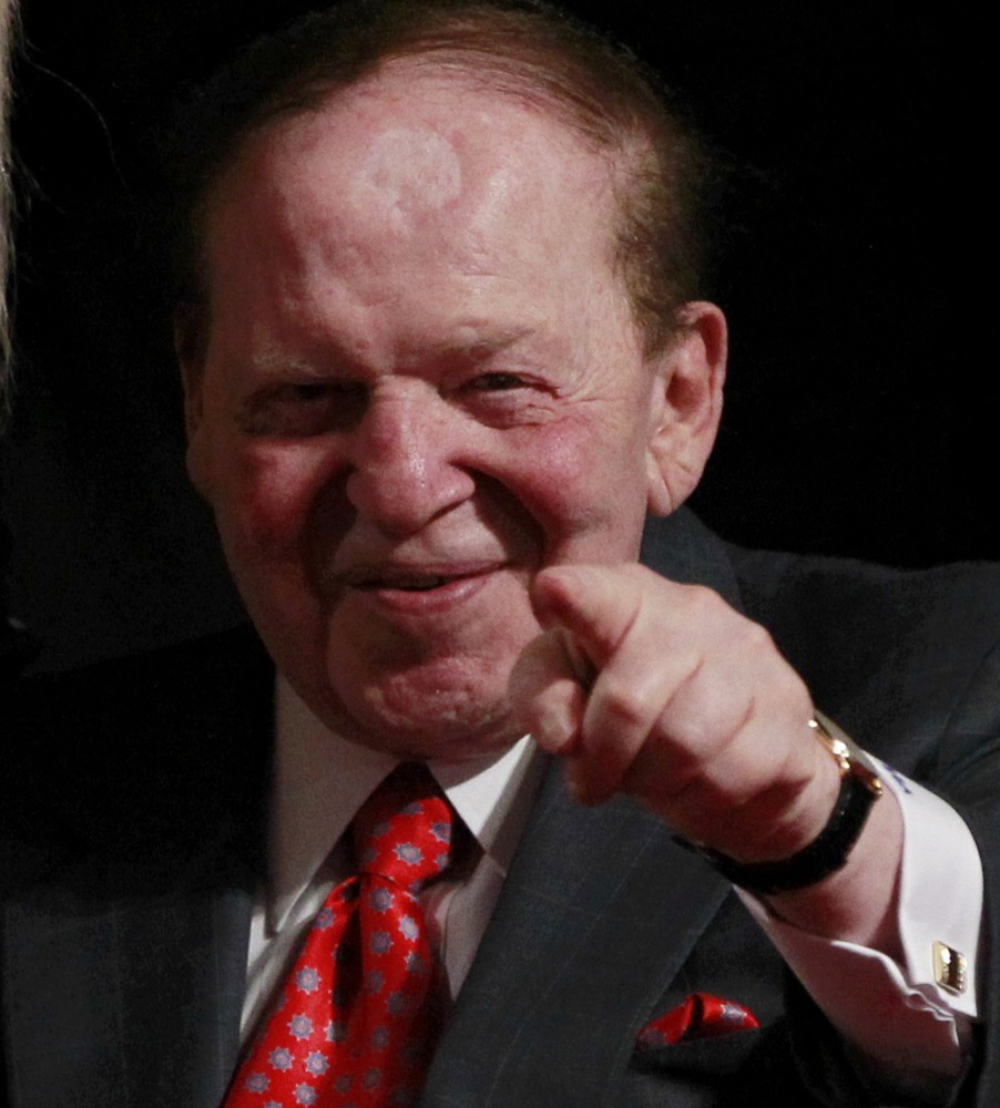 Chairman and CEO of the Las Vegas Sands casino Sheldon Adelson, a donor to Republican presidential nominee Mitt Romney, points to photographers at the end of the first presidential debate between Romney and President Barack Obama in Denver Oct. 3. ...