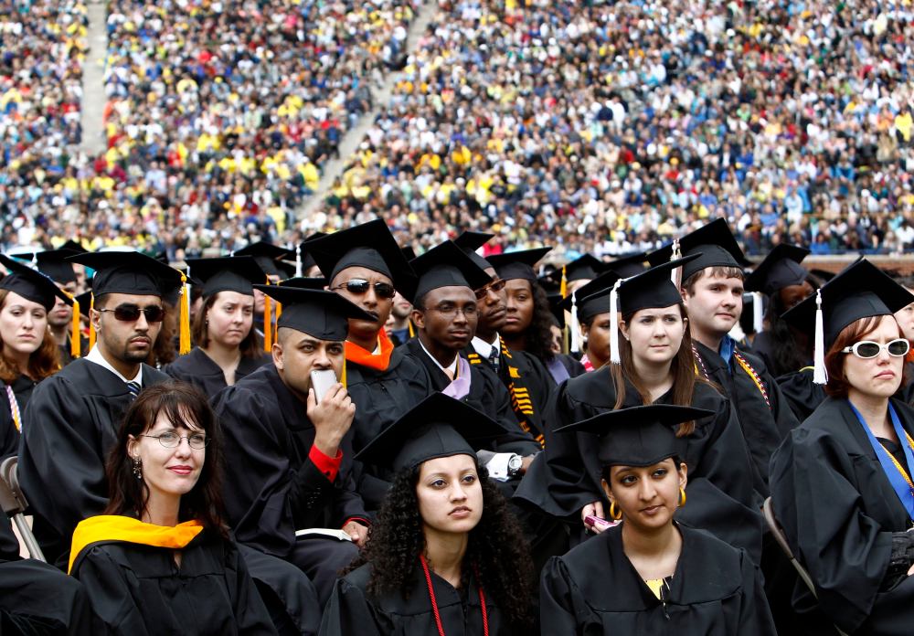 Graduating students listen to U.S. President Barack Obama speak at the University of Michigan commencement ceremony in Ann Arbor, Michigan in this May 1, 2010 file photograph (Photo: Reuters/Kevin Lamarque)
