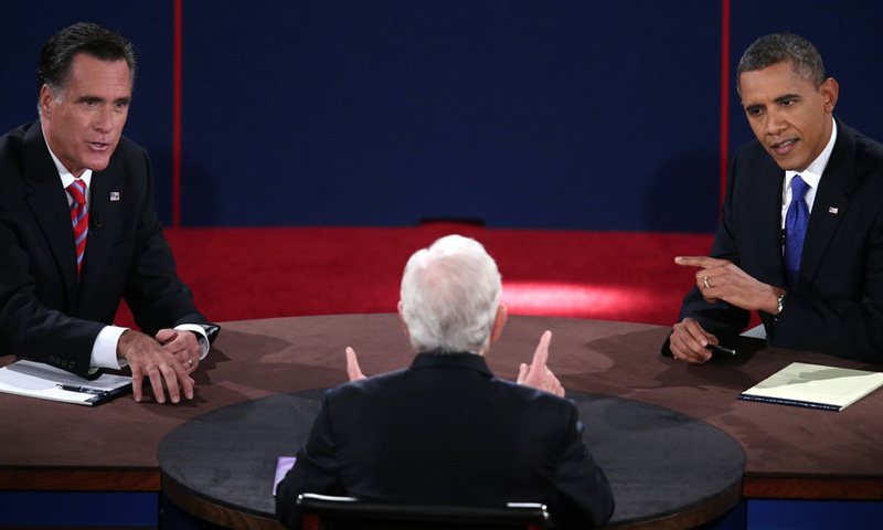 President Barack Obama and Republican presidential candidate Mitt Romney both make a point as moderator Bob Schieffer gestures during the third presidential debate on October 22 at Lynn University in Boca Raton, Fla. (Photo: Win MacNamee/AFP/Getty...