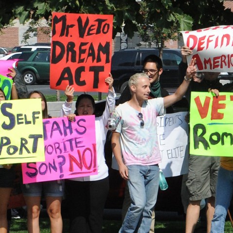Latino protesters march by the hotel where Republican presidential candidate Mitt Romney is scheduled to attend a fundraising event in Salt Lake City, Utah, September 17. (Nicholas Kamm/AFP/Getty Images)