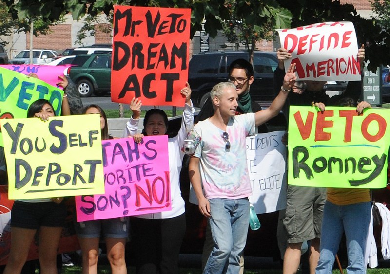 Latino protesters march by the hotel where Republican presidential candidate Mitt Romney is scheduled to attend a fundraising event in Salt Lake City, Utah, September 17. (Nicholas Kamm/AFP/Getty Images)