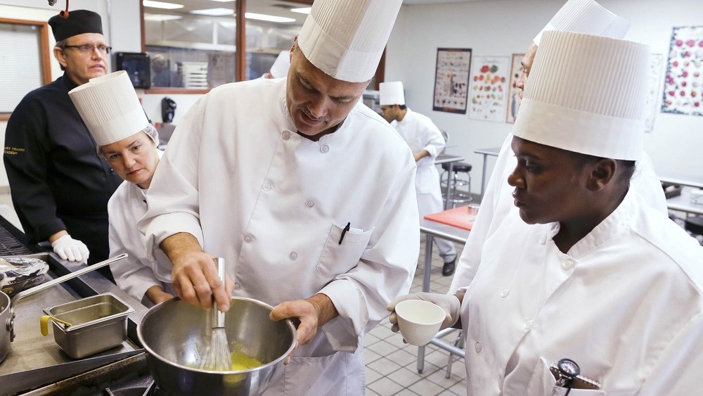 Students in a professional cook class make hollandaise sauce as instructor Larry Baumann, far left, looks on at the Culinary Academy of Las Vegas, Friday, Dec. 14, 2012, in Las Vegas. The academy is funded through a trust created by the culinary and...