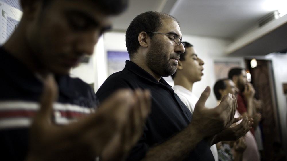 Muslim-American men offer evening prayers after breaking their day-long Ramadan fast on Aug. 24, 2011 at Islamic Center of Bay Ridge in the Brooklyn borough of New York.
