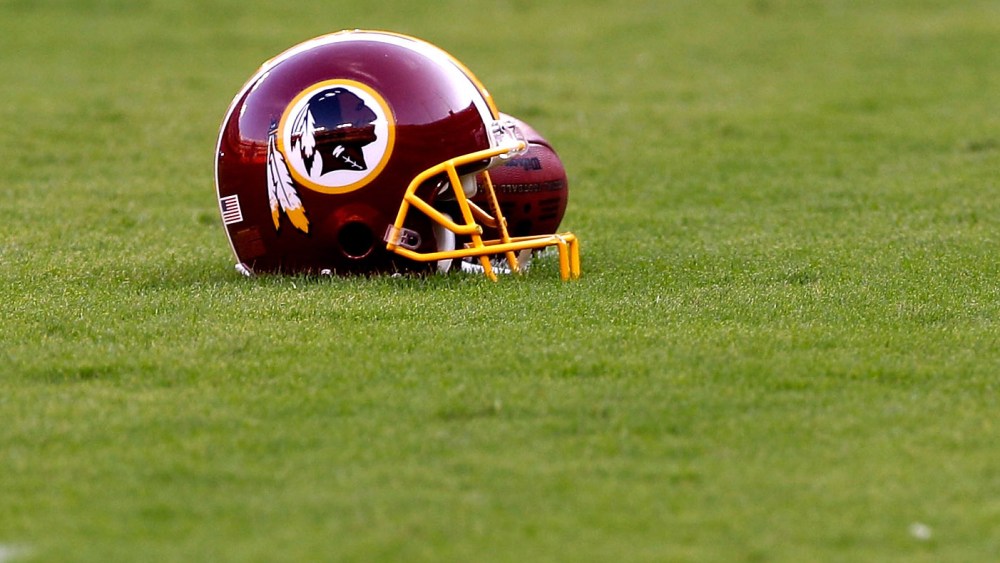 File Photo: A Washington Redskins helmet sits on the field before the start of the preseason game between the Tampa Bay Buccaneers and Redskins at FedExField on September 1, 2011 in Landover, Maryland.  (Photo by Rob Carr/Getty Images, File)