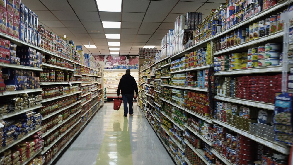 A man walks through a grocery store in Bridgeport, Connecticut.
