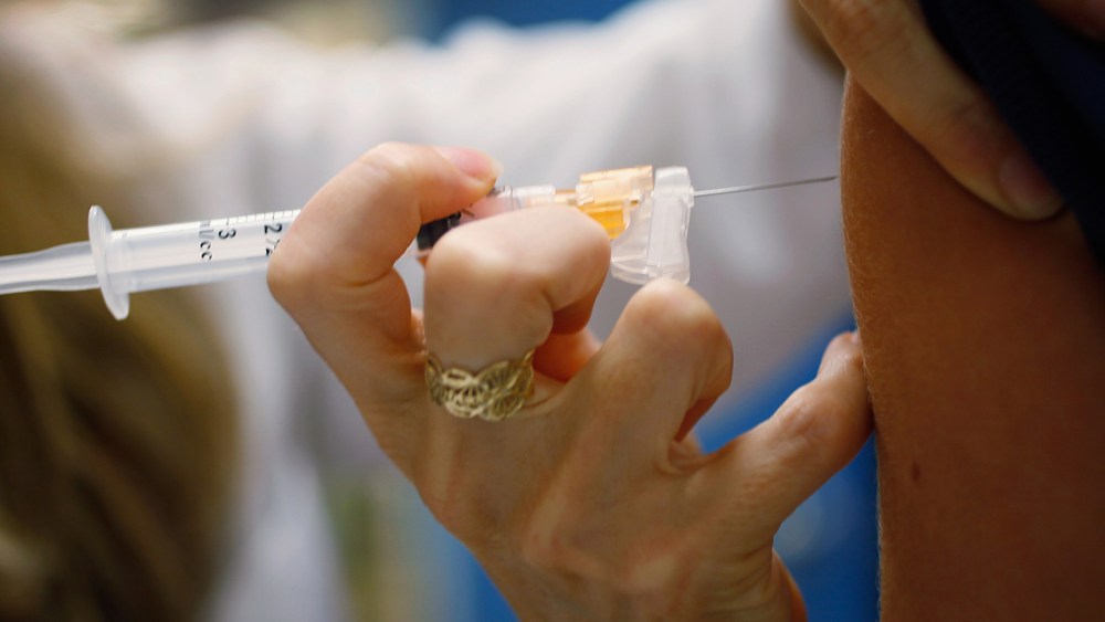 A doctor administers an HPV vaccination to a patient in her office on Sept. 21, 2011 in Miami, Florida.