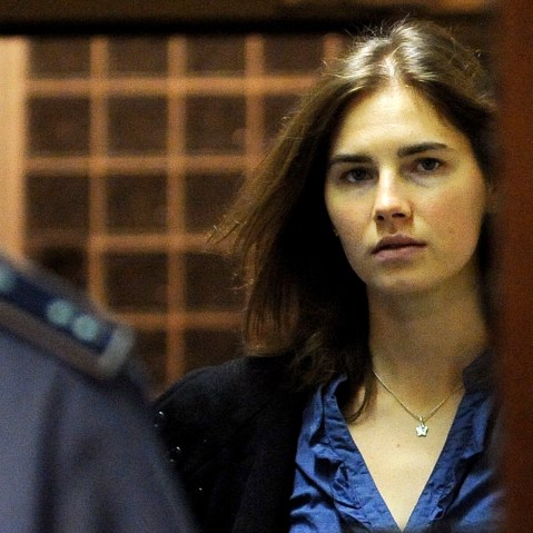 Amanda Knox (R), US national accused of the 2007 murder of her housemate Meredith Kercher arrives at the court during the resumption of her appeal trial in Perugia on Sept. 30, 2011. (Photo by Tiziana Fabi/AFP/Getty)