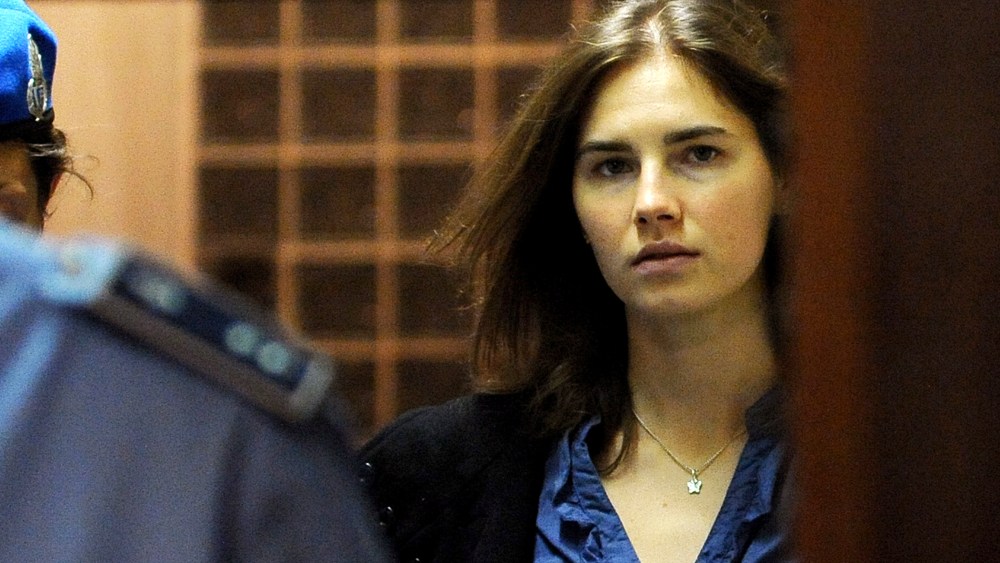 Amanda Knox (R), US national accused of the 2007 murder of her housemate Meredith Kercher arrives at the court during the resumption of her appeal trial in Perugia on Sept. 30, 2011. (Photo by Tiziana Fabi/AFP/Getty)