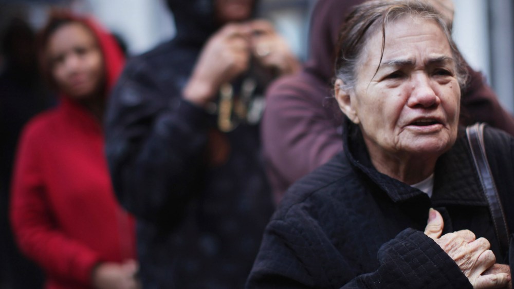 People wait in line to receive free milk from the Milk from the Heart program which makes weekly deliveries to Washington Heights and 12 other locations in Manhattan and the Bronx on October 6, 2011 in New York City.  As the economy throughout the...