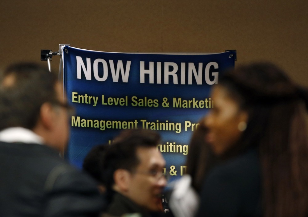 Job seekers stand in line to meet with prospective employers at a career fair in New York City in this file photo taken October 24, 2012.(REUTERS/Mike Segar)