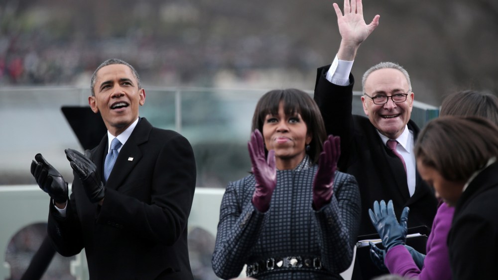 President Barack Obama, First Lady Michelle Obama and Sen. Charles Schumer (D-NY) clap during the presidential inauguration on January 21, 2013 in Washington, DC. (Photo by Ewin McNamee/AFP/Getty Images)