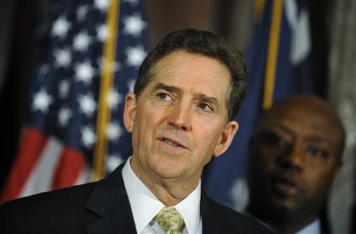 Then-Rep. Tim Scott, standing on Jim DeMint's good side. (AP Photo/Rainier Ehrhardt)