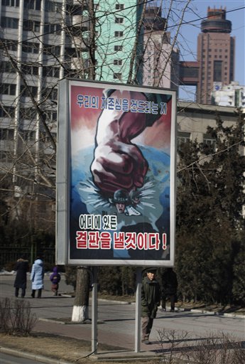 A billboard showing a fist crushing an American soldier reads "We will settle the score with those who hurt our pride wherever they are" in Pyongyang, North Korea, 2008. (AP Photo/David Guttenfelder)