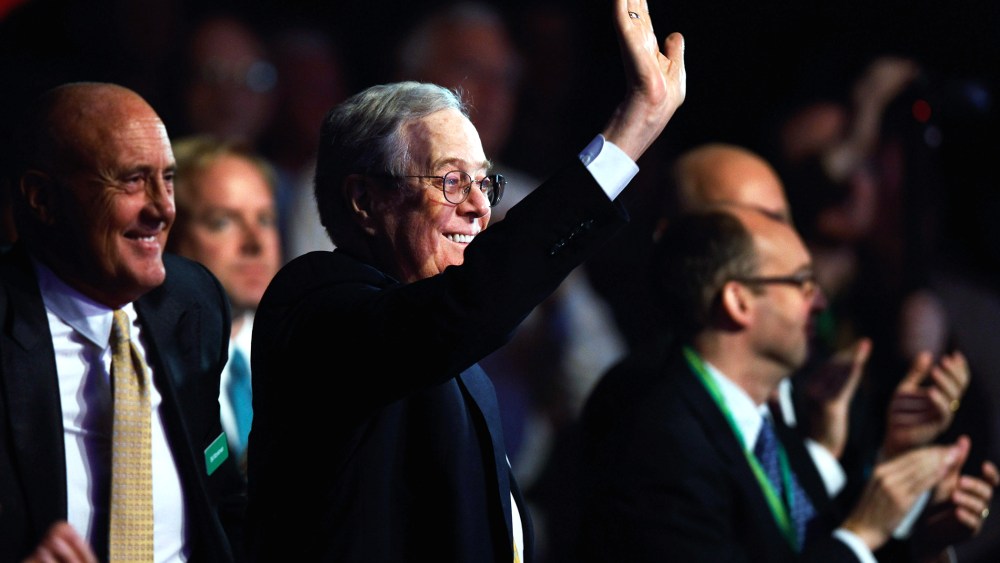 Americans for Prosperity Foundation chairman and Koch Industries Executive Vice President David H. Koch (C) waves during an event at the Washington Convention Center, Nov. 4, 2011 in Washington, DC. (Photo by Chip Somodevilla/Getty)