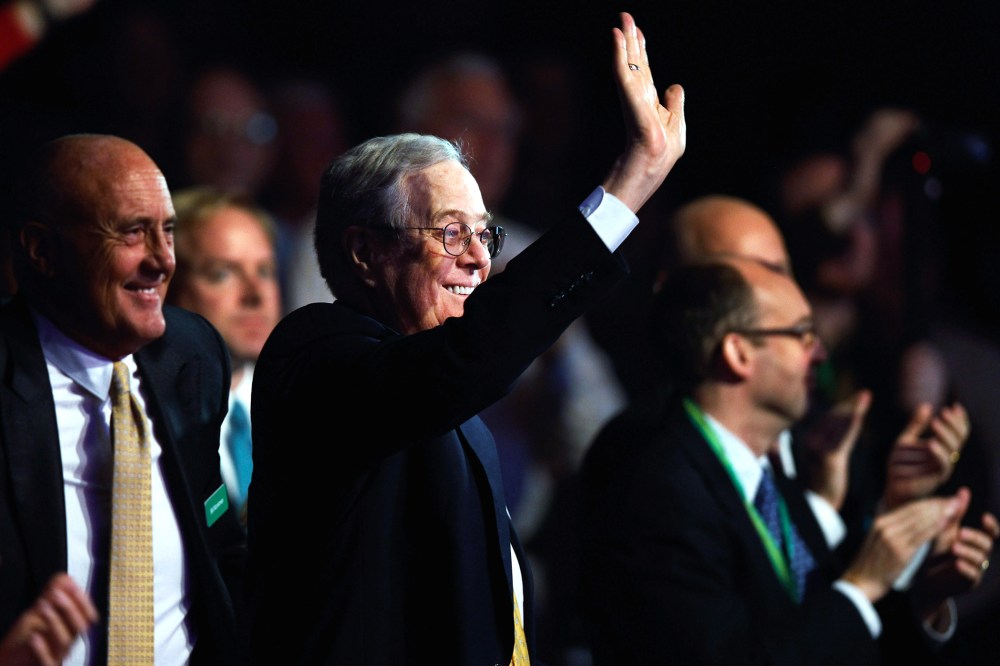 Americans for Prosperity Foundation chairman and Koch Industries Executive Vice President David H. Koch (C) waves during an event at the Washington Convention Center, Nov. 4, 2011 in Washington, DC. (Photo by Chip Somodevilla/Getty)