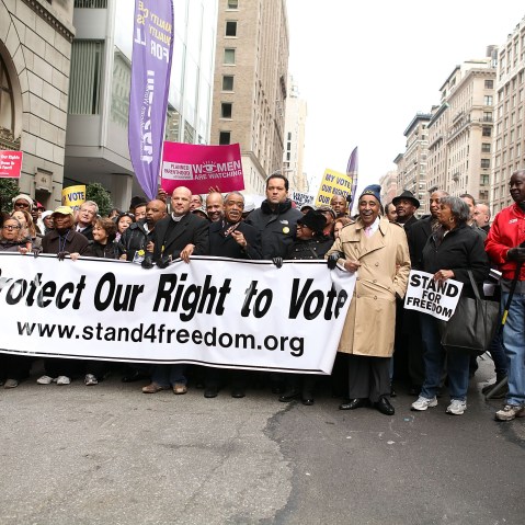 File Photo: (L-R) Lillian Rodriguez Lopez, Dr. Hazel N. Dukes, George Gresham, Michael Mulgrew, John Payton, Rev. Al Sharpton, Benjamin Jealous, Barbara Arnwine and U.S. Rep. Charles Rangel attend a march to protect voting rights on the United Nations...