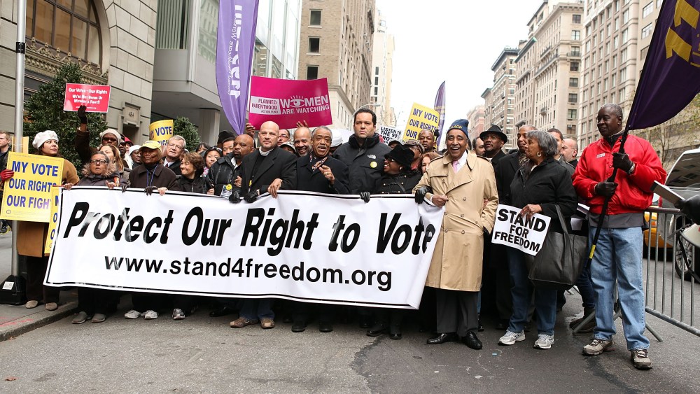 File Photo: (L-R) Lillian Rodriguez Lopez, Dr. Hazel N. Dukes, George Gresham, Michael Mulgrew, John Payton, Rev. Al Sharpton, Benjamin Jealous, Barbara Arnwine and U.S. Rep. Charles Rangel attend a march to protect voting rights on the United Nations...