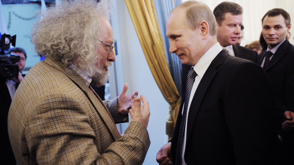 Russia's Prime Minister Vladimir Putin speaks with Ekho Moskvy radio editor-in-chief Alexei Venediktov during an awarding ceremony in Moscow, Jan. 13, 2012.
