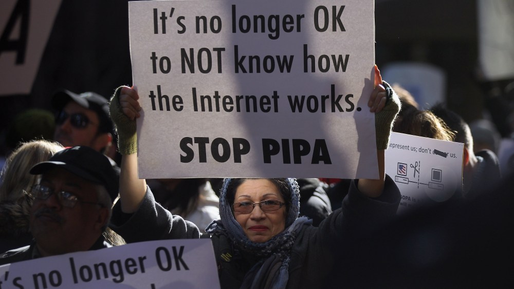 Protesters demonstrate against the proposed Stop Online Piracy Act (SOPA) and Protect IP Act (PIPA) outside the offices of U.S. Sen. Charles Schumer (D-NY) and U.S. Sen. Kirsten Gillibrand (D-NY) on January 18, 2012 in New York City.  The controversial...