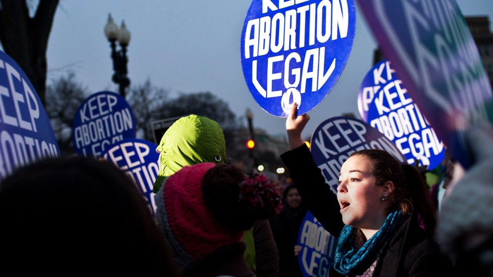 Pro-choice activists hold a vigil outside the U.S. Supreme Court on Jan. 23, 2012 in Washington, DC. (Photo by Brendan Hoffman/Getty)