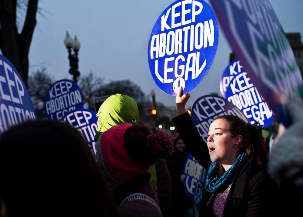 Pro-choice activists hold a vigil outside the U.S. Supreme Court on Jan. 23, 2012 in Washington, DC. (Photo by Brendan Hoffman/Getty)