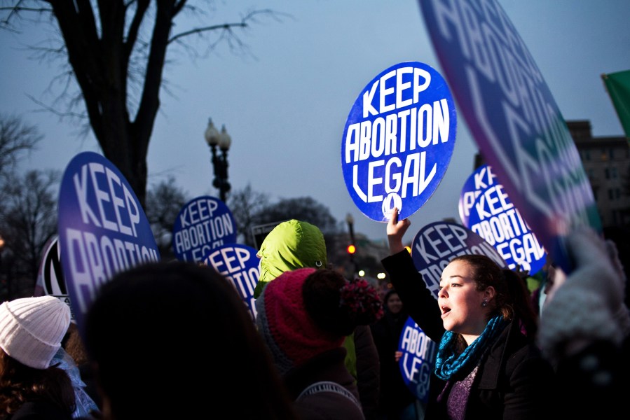 Pro-choice activists hold a vigil outside the U.S. Supreme Court on January 23, 2012 in Washington, DC. (Photo by Brendan Hoffman/Getty)
