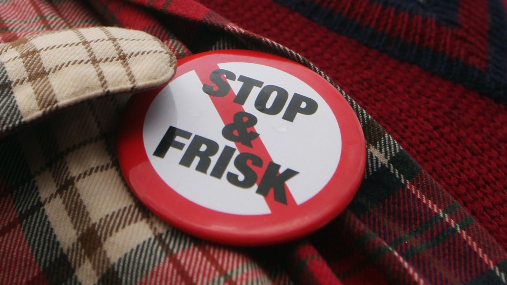File Photo: An opponent of the New York Police Department's controversial "stop-and-frisk" policy march on January 27, 2012 in New York City. (Photo by Mario Tama/Getty Images/File)