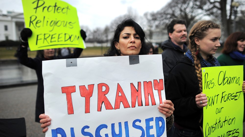 Christian religious activists display placards during a pro-life demonstration in front of the White House