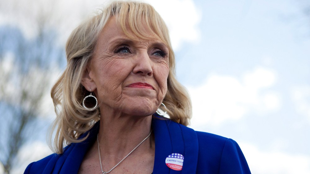 Arizona Gov. Jan Brewer talks to news media after voting in the Republican presidential primary on Feb. 28, 2012 in Glendale, Ariz.