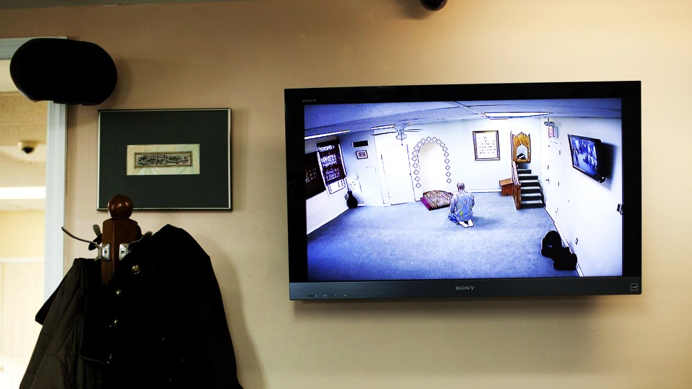 A CCTV monitor displays a man praying at the Iqra Masjid in Brooklyn, New York, Feb. 25, 2012.