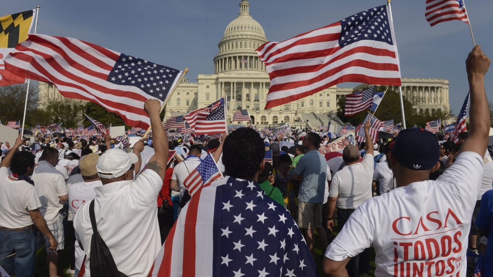People show their support during a rally for comprehensive immigration reform on the West Front of the U.S. Capitol in Washington D.C., April 10, 2013.