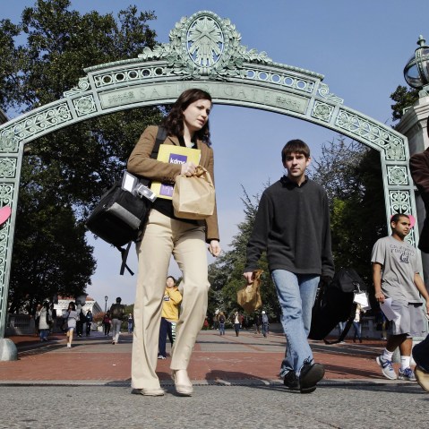 University of California Berkeley students walk through Sather Gate on the campus in Berkeley, Calif. (Photo by Paul Sakuma/AP)
