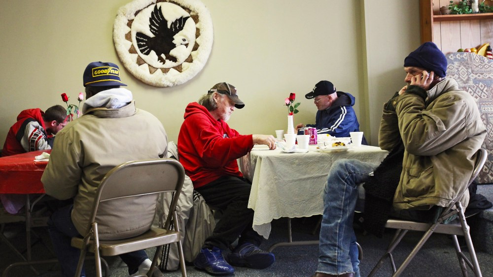 People eat a free community meal at The Center on March 4, 2012 in Lima, Ohio. A census report released in 2011 showed that 15.3 percent of Ohioans live in poverty, the highest rate in the state in more than 30 years.