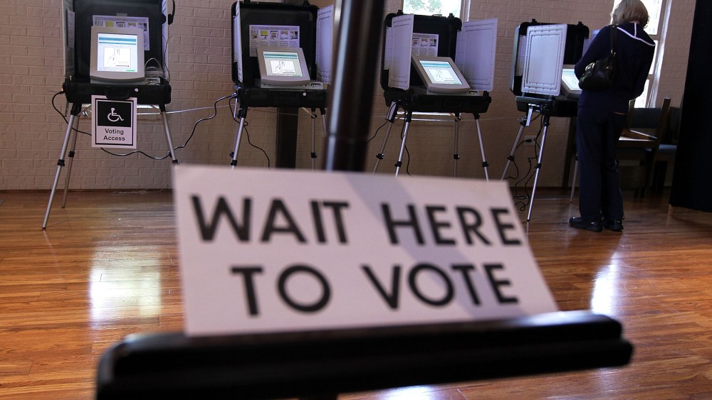A local resident casts her vote at a polling station in St Andrew Presbyterian Church March 6, 2012 in Sandy Springs, Georgia.
