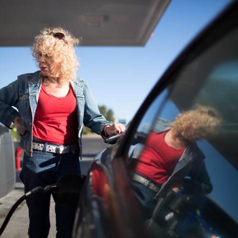 Denee Mallon pumps gas into her Ford Mustang in Albuquerque, N.M. Mallon is an Army veteran and transgender woman and is about to be the first person to have Medicare pay for her male to female sex reassignment surgery, Oct. 1, 2014. (Jim Seida/NBC News)