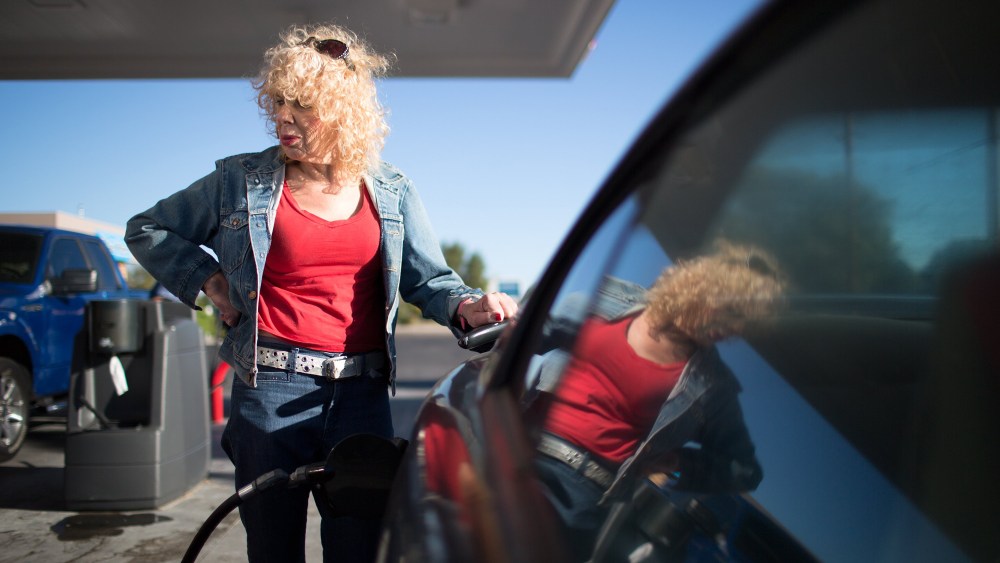 Denee Mallon pumps gas into her Ford Mustang in Albuquerque, N.M. Mallon is an Army veteran and transgender woman and is about to be the first person to have Medicare pay for her male to female sex reassignment surgery, Oct. 1, 2014. (Jim Seida/NBC News)