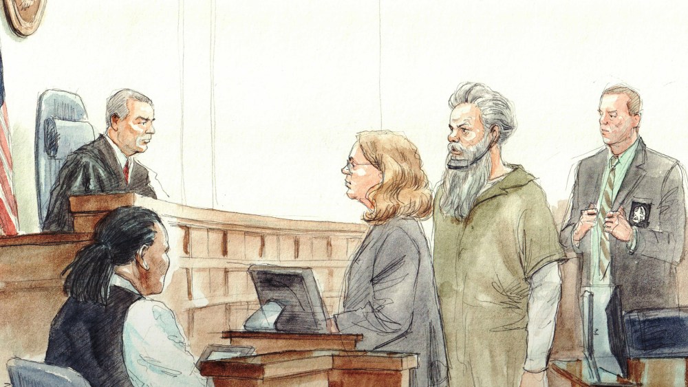 Ahmed Abu Khatallah arraigned before US Dist. judge Christopher R Cooper. Defense attny. Michelle Peterson at lectern in 2014. (Arthur Lien)