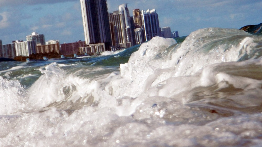 File Photo: Buildings are seen near the ocean as reports indicate that Miami-Dade County in the future could be one of the most susceptible places when it comes to rising water levels due to global warming on March 14, 2012 in North Miami, Florida....
