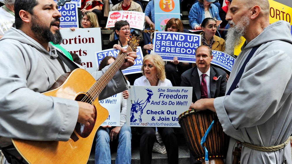 Demonstrators protest during a "Stand Up for Religious Freedom" rally, at Federal Hall National Memorial in New York on March 23, 2012.