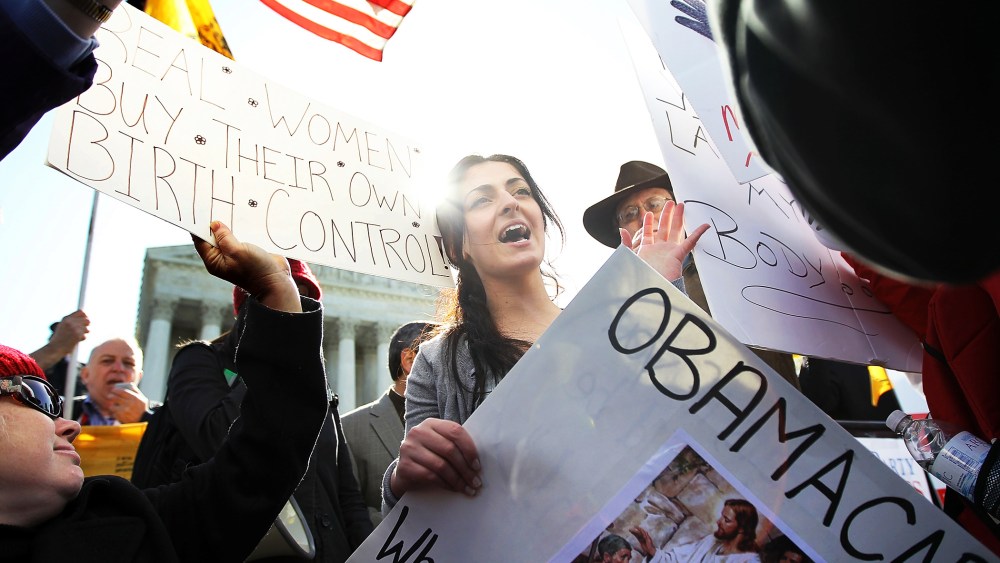 Protesters gather in front of the U.S. Supreme Court in advance of oral arguments on the Patient Protection and Affordable Care Act, March 27, 2012.