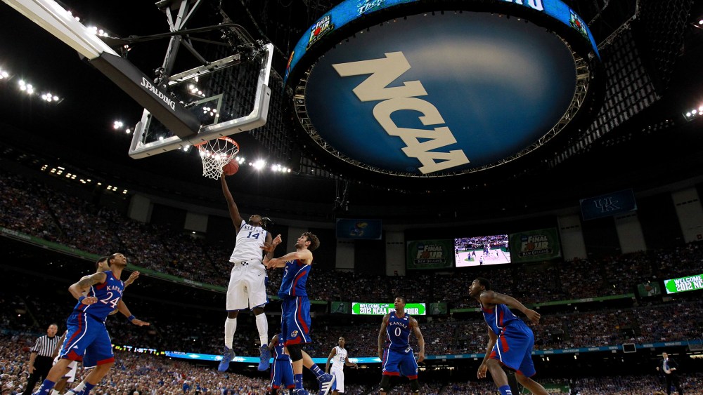 The NCAA logo is seen as the Kentucky Wildcan as the Kentucky Wildcats play against the Kansas Jayhawks in the first half in the National Championship Game of the 2012 NCAA Division I Men's Basketball Tournament on April 2, 2012 in New Orleans, Louisiana.
