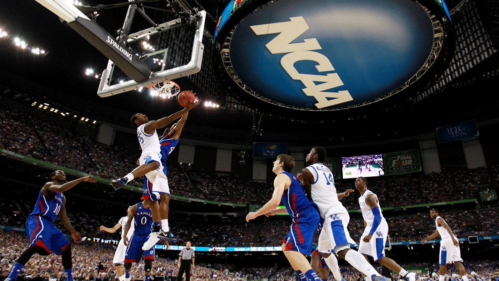 The NCAA logo is seen as the Kentucky Wildcats play against the Kansas Jayhawks in the National Championship Game of the 2012 NCAA Division I Men's Basketball Tournament on April 2, 2012 in New Orleans, La.