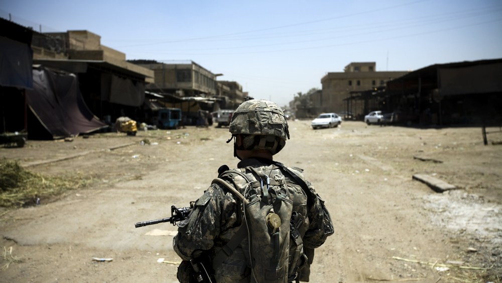 An American soldier on patrol in Jamilla Market on July 15 2008 in Sadr City, Iraq. (Photo by Benjamin Lowy/ Getty)