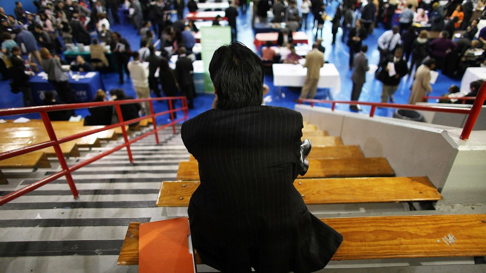 A man takes a break from at a job fair, May 3, 2012, in New York, N.Y.