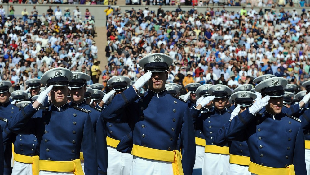 US Air Force cadets salute during the commencement address at the US Air Force Academy in Colorado Springs, Colo., on May 23, 2012. (Photo by Jewel Samad/AFP/Getty)