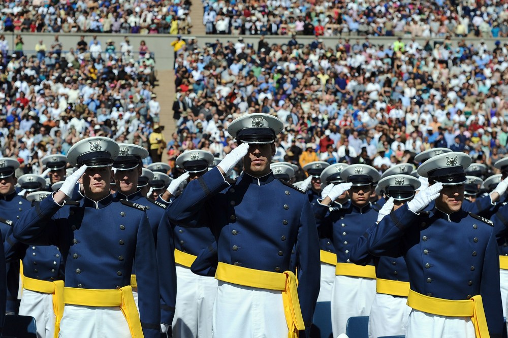 US Air Force cadets salute during the commencement address at the US Air Force Academy in Colorado Springs, Colo., on May 23, 2012. (Photo by Jewel Samad/AFP/Getty)