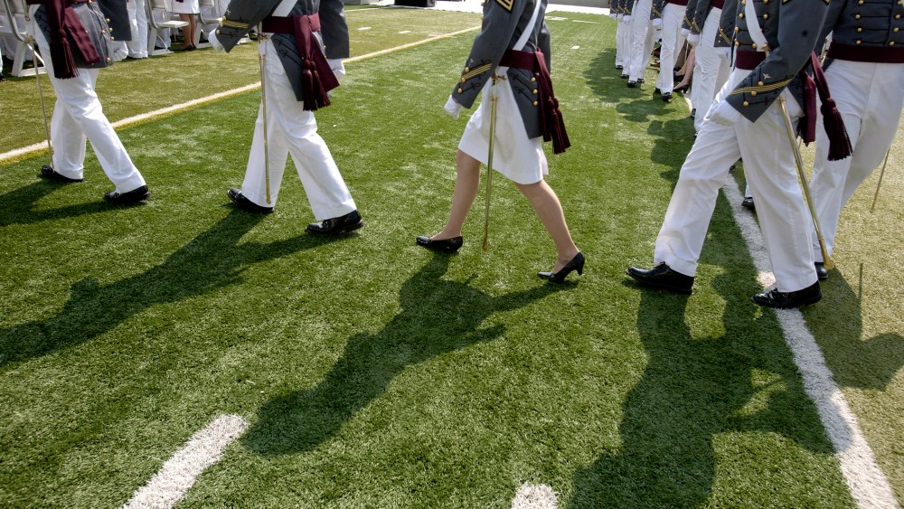 Cadets of The United States Military Academy walk to their seats for a graduation and commissioning ceremony May 26, 2012 in West Point, New York.